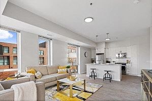 Spacious living room with plank flooring